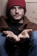 Fototapeta premium Man with open hands begging for help