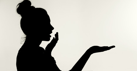 Silhouetthe of the surprised woman