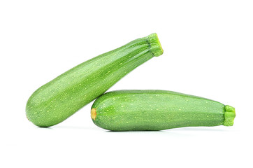 Pair of fresh green zucchini isolated on white background