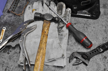Dirty set of hand tools on table