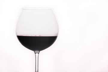 Red wine in a glass isolated on white background