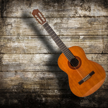 chitarra acustica in fondo legno
