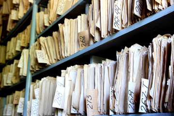 shelves full of files in an old archive - obrazy, fototapety, plakaty