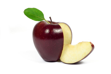 Fresh sliced red apple with green leaf isolated on white