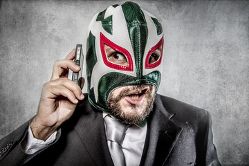 Trouble, aggressive executive suit and tie, Mexican wrestler mas