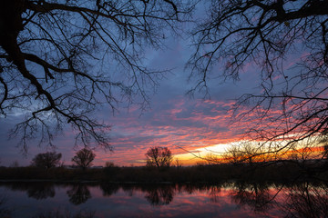 Sunrise over the lake with reflection 