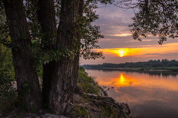 Sunrise over the lake with reflection 