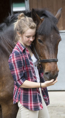 Young rider with her pony