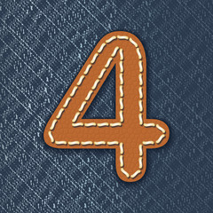 Number 4 made from leather on jeans background