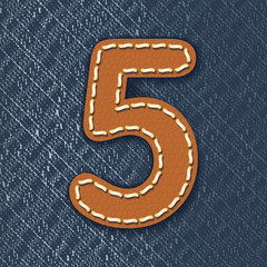 Number 5 made from leather on jeans background