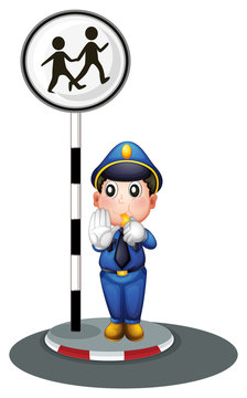 A policeman beside the street signage