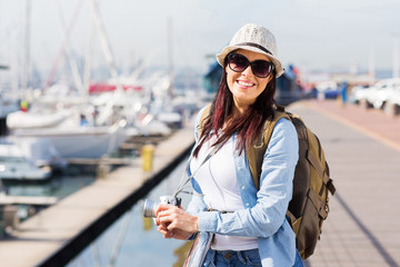 happy female tourist at the harbour