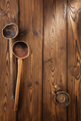 Fototapeta premium antique vintage wooden spoon on old wooden table in rustic style