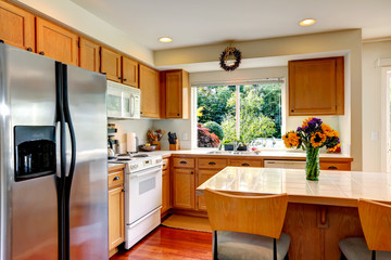 Cozy kitchen interior with island and window