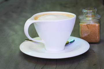 A cup of coffee  on wooden background