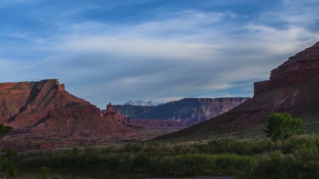 Clouds moving over the Colorado River Fisher Towers and La Sal M