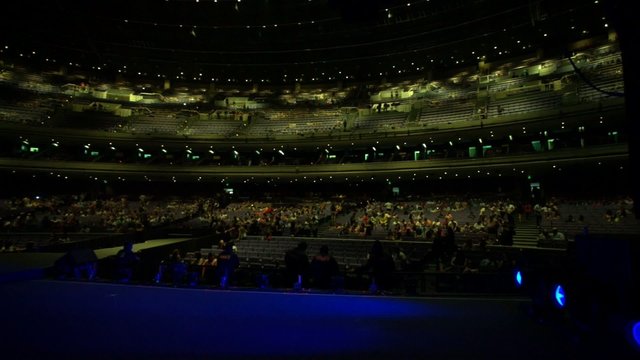 View from the stage of people walking in into a Coliseum