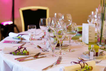 Elegant table set in lilac and green for wedding or event party