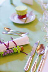 Elegant table set in lilac and green for wedding or event party