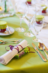 Elegant table set in lilac and green for wedding or event party