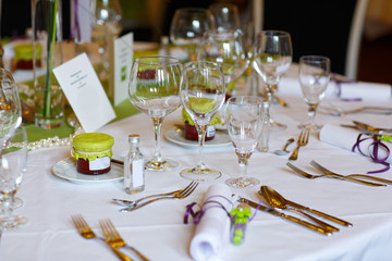 Elegant table set in lilac and green for wedding or event party