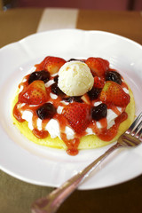 close up strawberry pancake in white dish