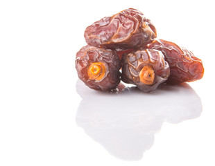 Date fruits over white background