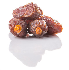 Date fruits over white background