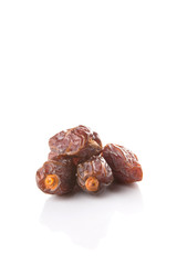 Date fruits over white background