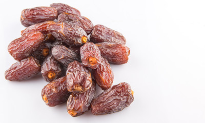 Date fruits over white background