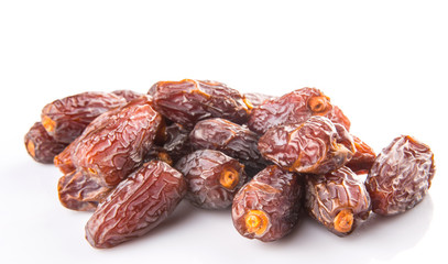 Date fruits over white background