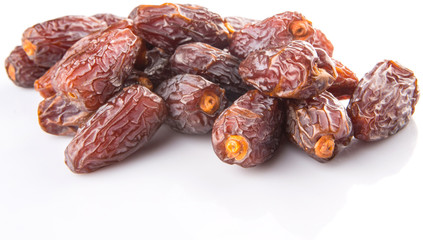 Date fruits over white background