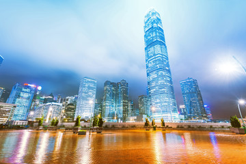Obraz na płótnie Canvas the light trails on the modern building background in hongkong c