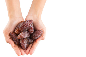 Female hands with date fruits over white background