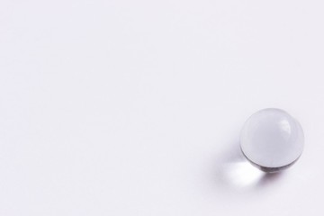 One clear glass marble - Lower right