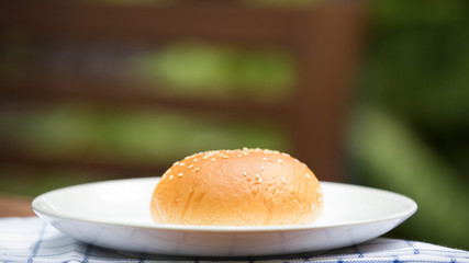 bread with sesame seeds on white plate