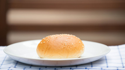 bread with sesame seeds on white plate