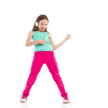 Young Girl Playing The Air Guitar