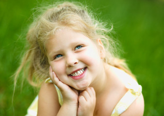 Young girl is playing outdoors