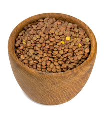 brown lentils in a woden bowl