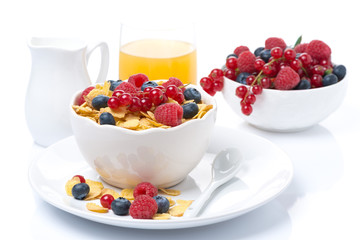 cornflakes with berries, milk and orange juice
