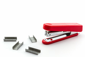 Red Stapler with staples wires.