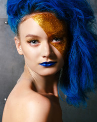 Portrait of young woman in superhero cosmetics
