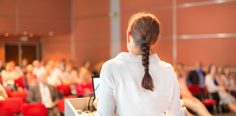 Female academic professor lecturing at the faculty.