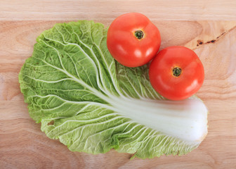 tomato and cabbage on wooden chopping board prepare cooking
