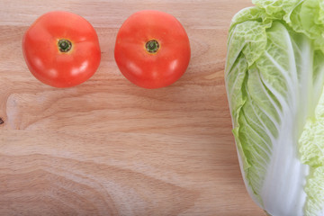 tomato and cabbage on wooden chopping board prepare cooking