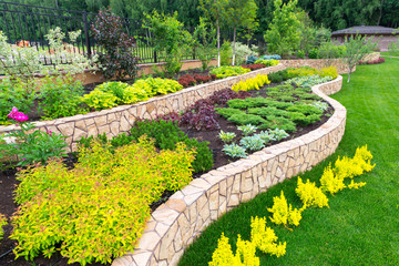 Landscape design in home garden. Landscaping, nature and house concept.
