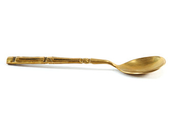 antique brass spoon on white  background