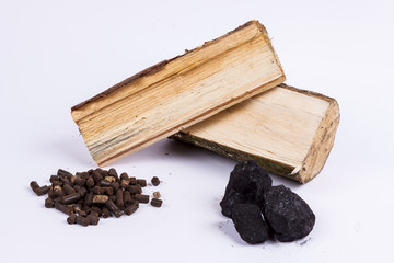 Timber, coal and biomass pellet on white background.