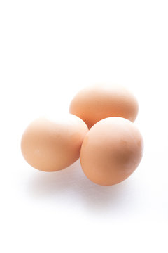 Three eggs isolated on white background.